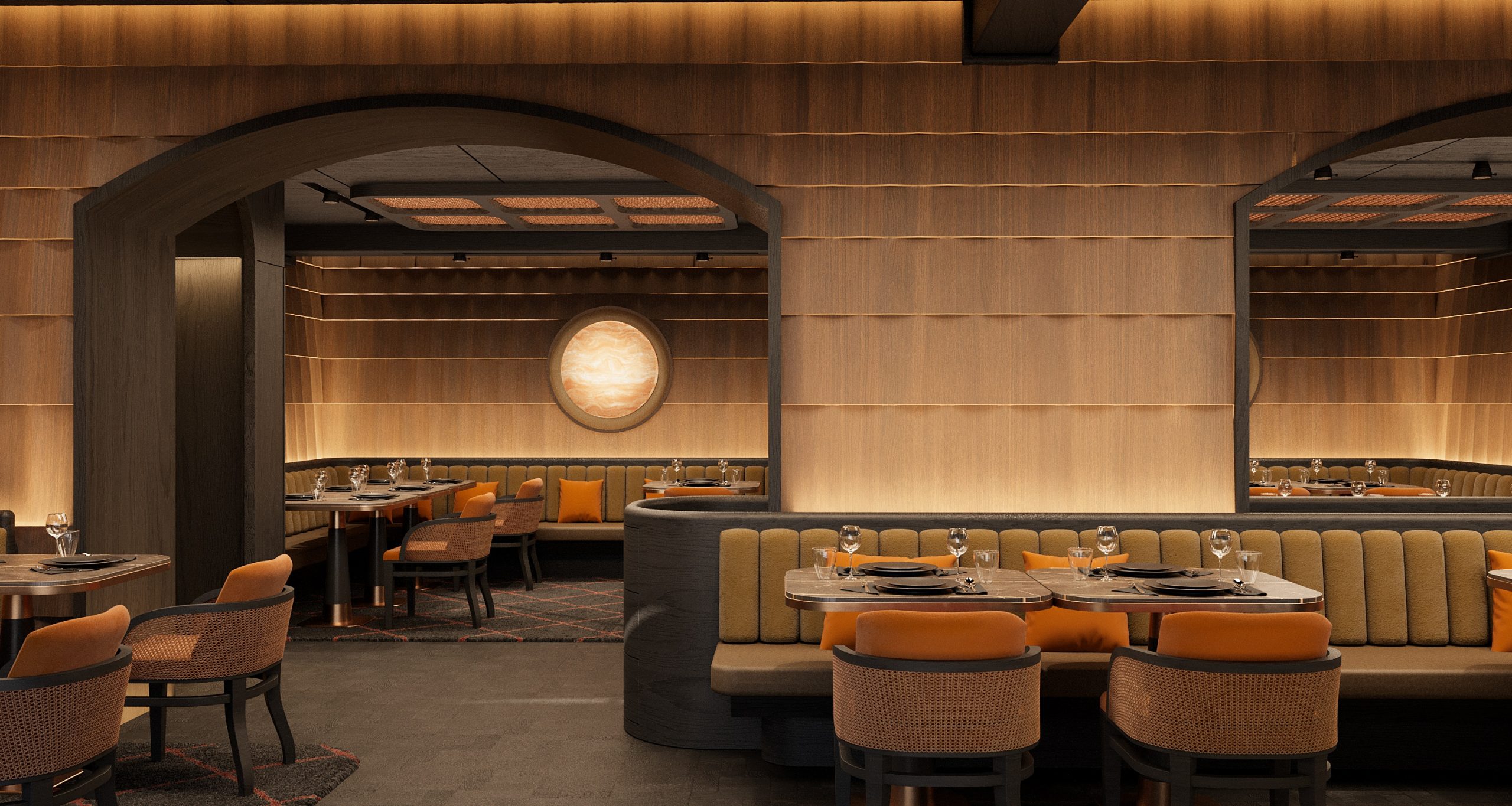 A modern restaurant interior with warm ambient lighting, wood-paneled walls, arched doorways, and booths with beige and orange seating. Tables are set with plates, glasses, and cutlery. A round light fixture is on the back wall.